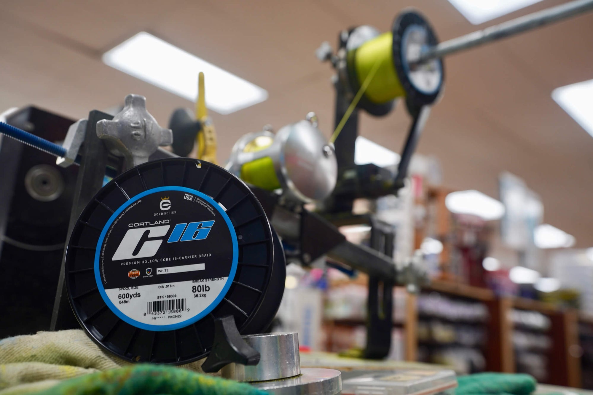 A spool of C16 is lining a fly reel