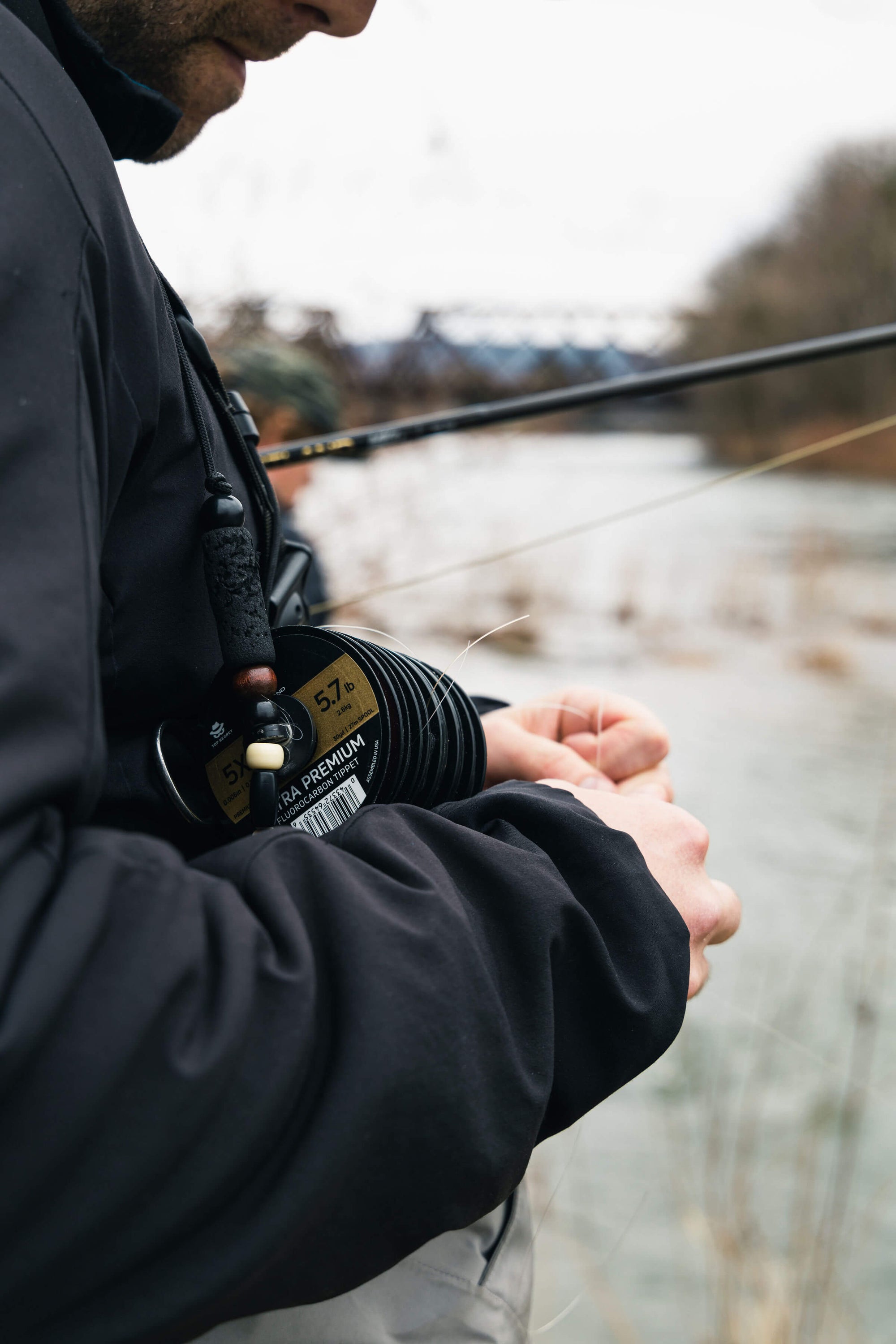 Angler preparing his Ultra Premium Fluorocarbon Tippet