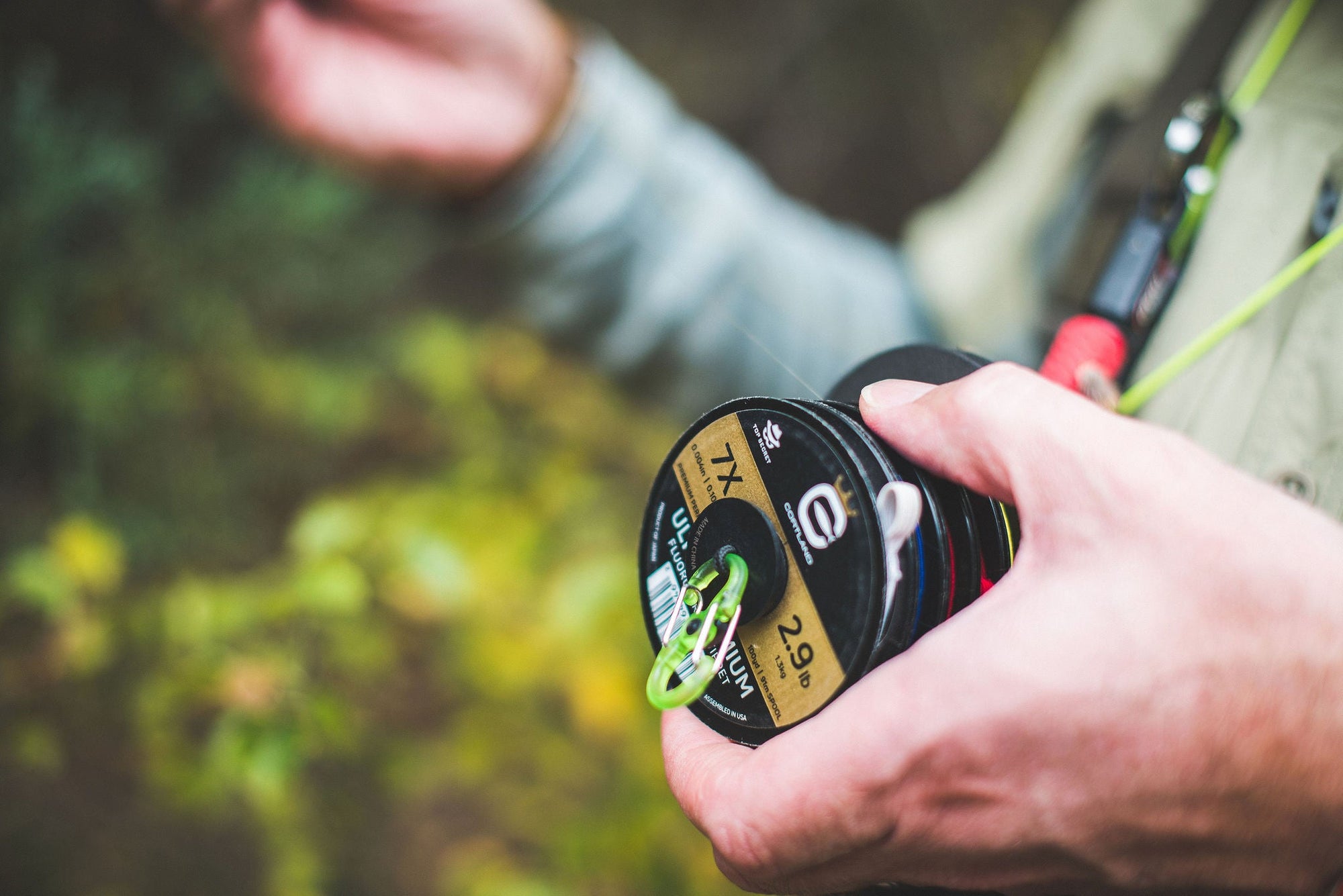 Someone holding onto a variety of Cortland Fly Fishing Tippet